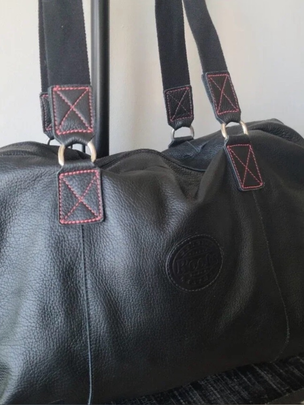 ROOTS Black Leather Travel Duffel with Red Contrast Stitching
